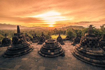 Dramatic sunset Borobudur Temple at sunset Yogyakarta, Java, Indonesia. - obrazy, fototapety, plakaty