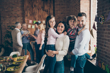 Close up photo of gathered relatives in decorated house dinner t