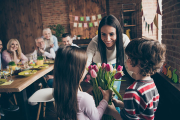Fototapeta premium Close up photo of gathered relatives in house table little small