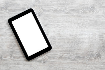 digital tablet on a gray wooden background