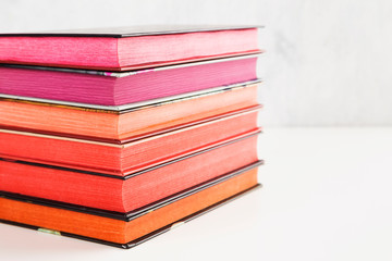 Pile of books with color stack on white background. Copy space