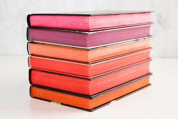 Pile of books with color stack on white background