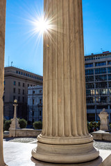 Fototapeta na wymiar Classical marble pillars detail on the facade of a building