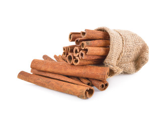 dried cinnamon stick in sack and on white background