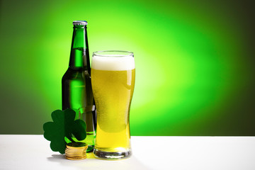 Buttle and glass of fresh cold beer. Concept for St. Patrick's day.