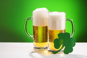 Two mugs of beer. Concept for St. Patrick's day.