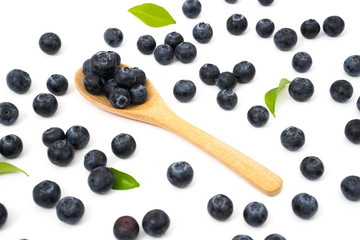 Naklejka na ściany i meble blueberries on spoon isolated on white background