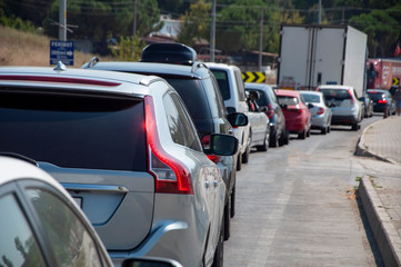 Cars are waiting in line at the ferry queue, traffic queue,