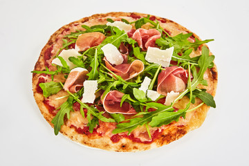 Margherita pizza topped with prosciutto ham