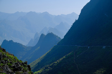 Winding roads through valleys and karst mountain scenery in the North Vietnamese region of Ha Giang / Dong Van.