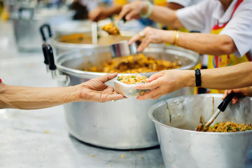 Providing food to the poor is helping sharing from fellow humans together : Concept of famine and...