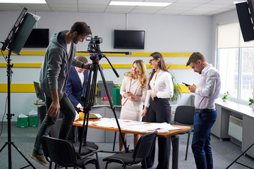 Film director discussing movie plan with the actors