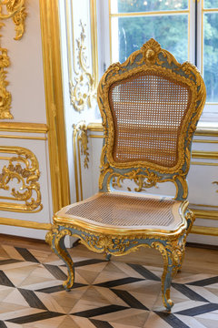 Vintage rococo chair in royal interior. Old fashion. Stock Photo | Adobe  Stock