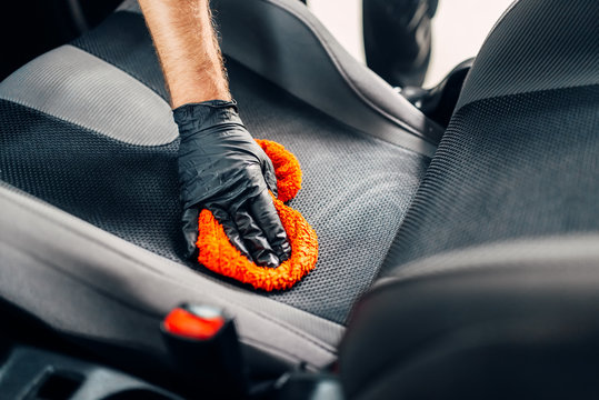 Chemical cleaning of car seats with spoonge