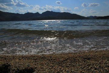 The sand and the lake in the mountains