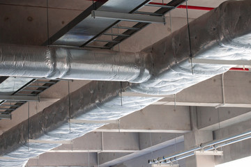 Typical installation of ducting with fiberglass insulation work combine with cable tray and fire fighting pipe