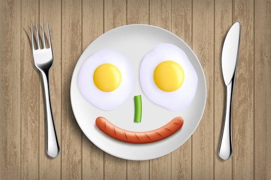 Plate with fried eggs, vegetable and sausage like a smiling face.