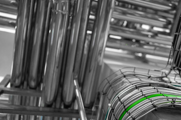 Fototapeta premium Industrial pipelines and modern equipment in cheese production interior
