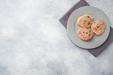 Sandwiches with chicken pate and butter on the table.