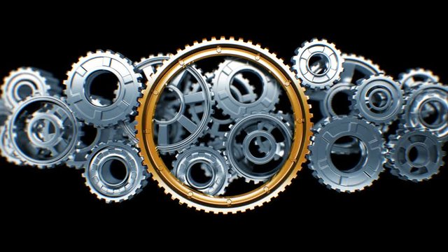 Big Golden Gear Cooperating with Steel Gears in Working Mechanism with DOF Blur. Beautiful Looped 3d Animation with Alpha Matte. Teamwork Business and Technology Concept. 4k Ultra HD 3840x2160.