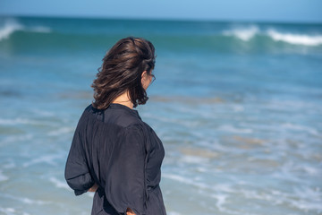 Woman staring at ocean