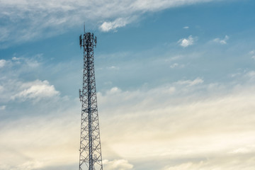 Telecommunication, wireless communication tower with evening sky background.Transmitter station tower against beautiful blue sky and clouds.