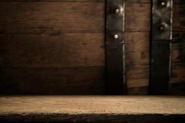 background of barrel and worn old table of wood