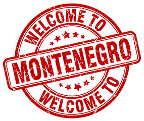 welcome to Montenegro red round vintage stamp