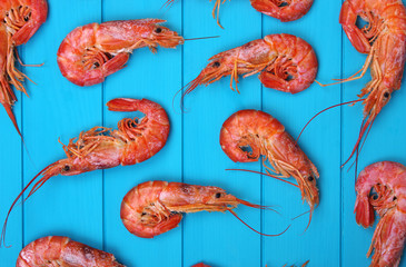 Shrimps background on wood