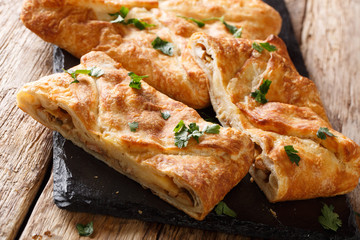 Georgian traditional Khachapuri stuffed with Suluguni cheese, eggs close-up. horizontal