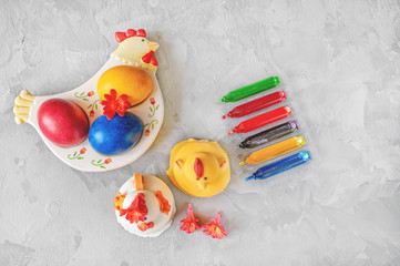 Multi-colored Easter eggs lie on a plate in the form of a chicken. Easter Brunch Copy space