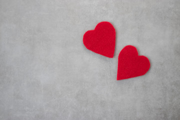 Obraz premium Two red decorative hearts on gray background. I love you. Valentine's Day Concept.