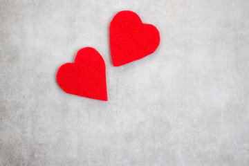 Obraz premium Two red decorative hearts on gray background. I love you. Valentine's Day Concept.