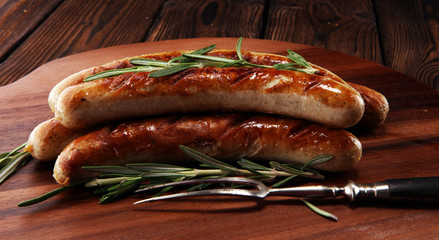 Grilled sausages with spices on a wooden table - Home-made Pork Sausages