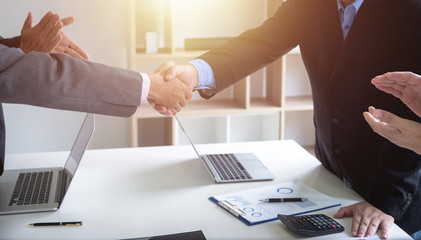 Successful businessmen handshaking good deal after negotiation. Concept of partnership.