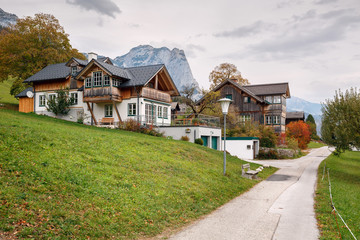Fototapeta na wymiar Residential neighborhood. View of the Alps. Town of Grundlsee, Styria, Austria.