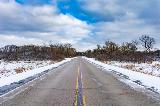 Empty Snow Lined Road In Suburban Chicago