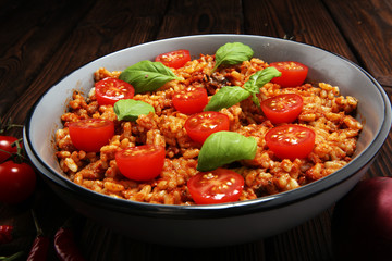 risotto with tomatoes, fresh herbs and parmesan cheese.