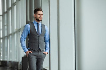 Fototapeta premium Portrait of a businessman looking at the window