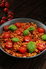 risotto with tomatoes, fresh herbs and parmesan cheese.