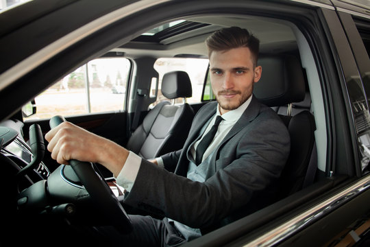 Young Business Man Test Drive New Car.