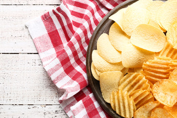 Potato chips on cutting board
