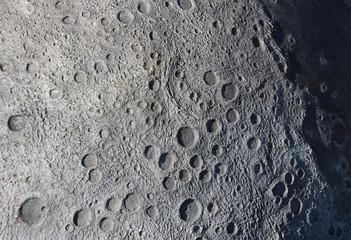 A picture of craters on the surface of the moon.