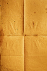 Empty orange notepaper folded in four