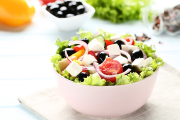 Vegetable salad in bowl with napkin
