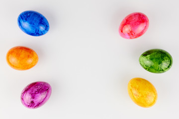 Colored Easter eggs on white background.