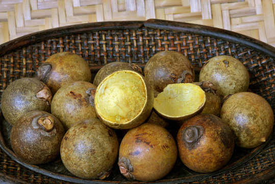 Brazilian fruit: stack of macauba on wicker basket