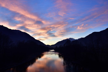 Painted clouds over Adda river.