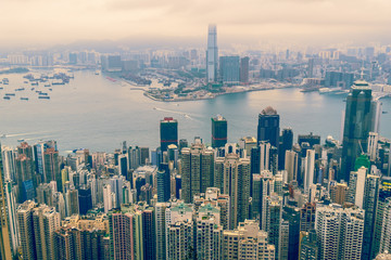 Fototapeta premium Modern City and Business with foggy weather from Victoria Peak, Hong Kong.