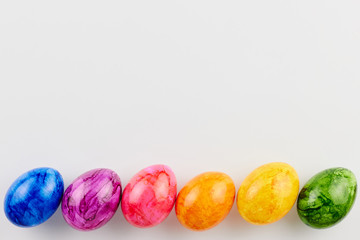 Colored Easter eggs on white background.